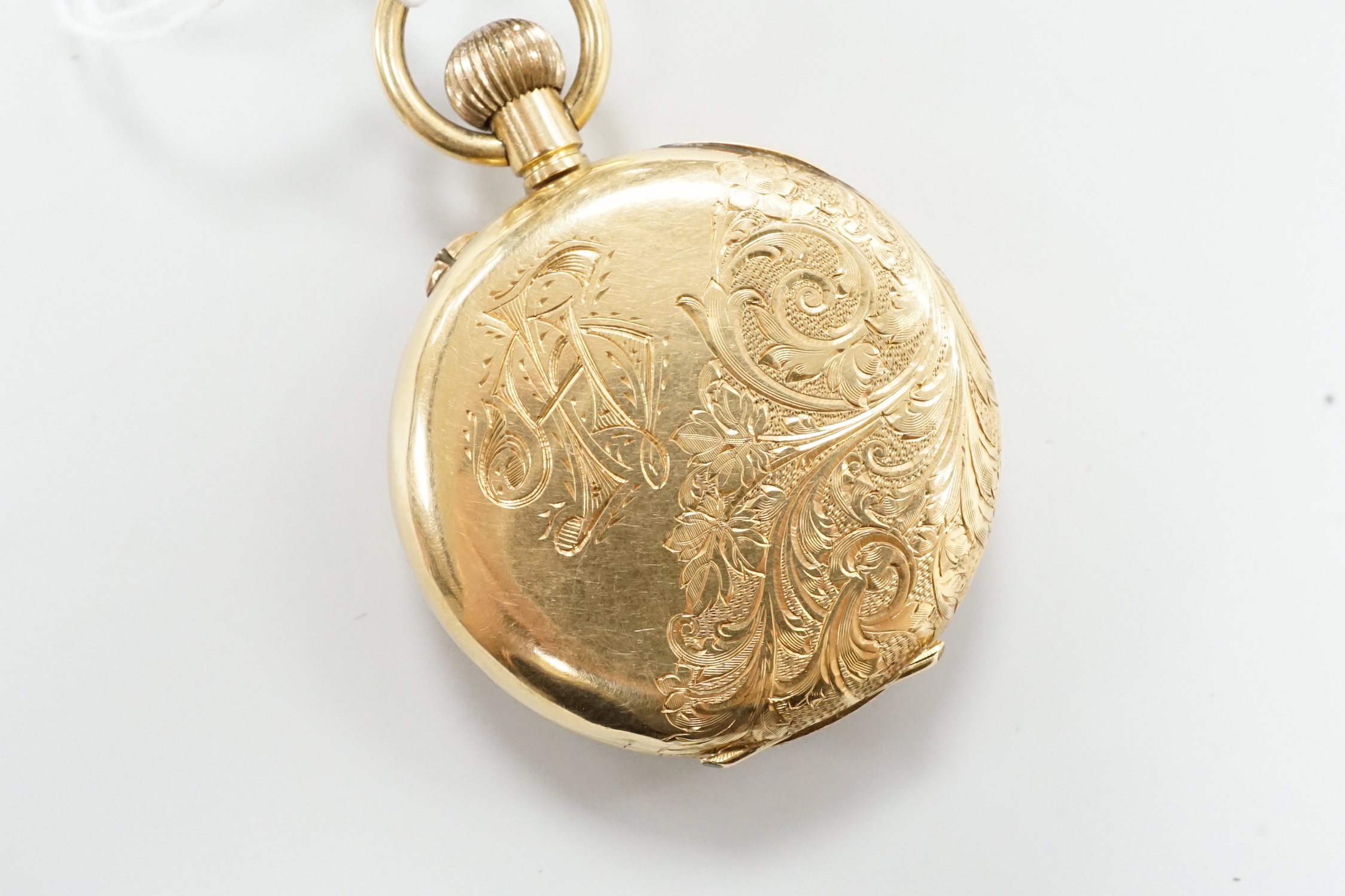 An engraved 18k open faced keyless fob watch, with Roman dial, case diameter 36mm